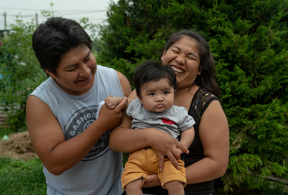 Jose, Miguel, and Zulema smile together after Miguel's cleft surgery