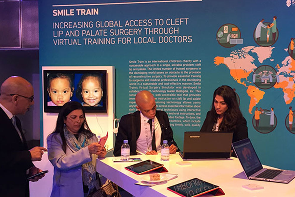 Priya Desai educating about Smile Train at our booth at a conference