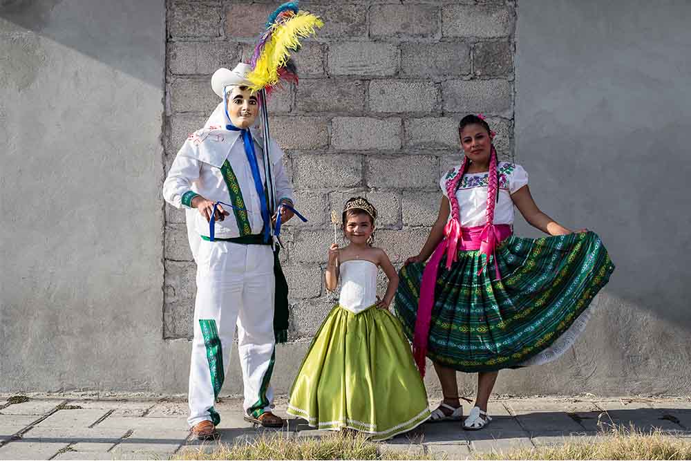 alexa stands next to other Carnival partipants