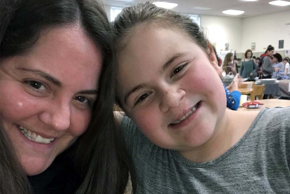 Alyson Ferguson with her daughter at school