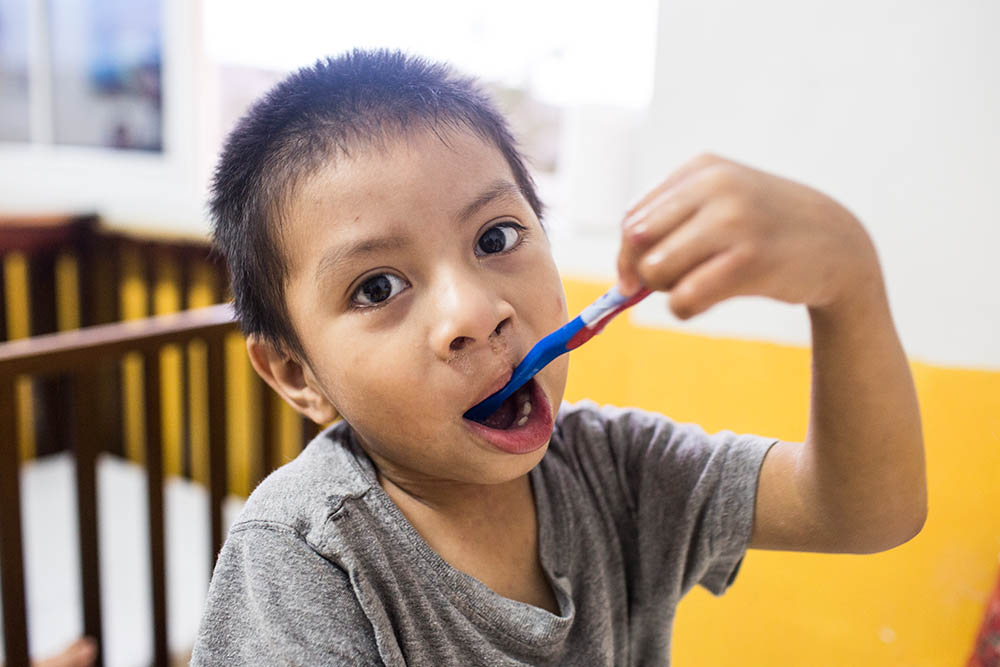 Auner brushes his teeth