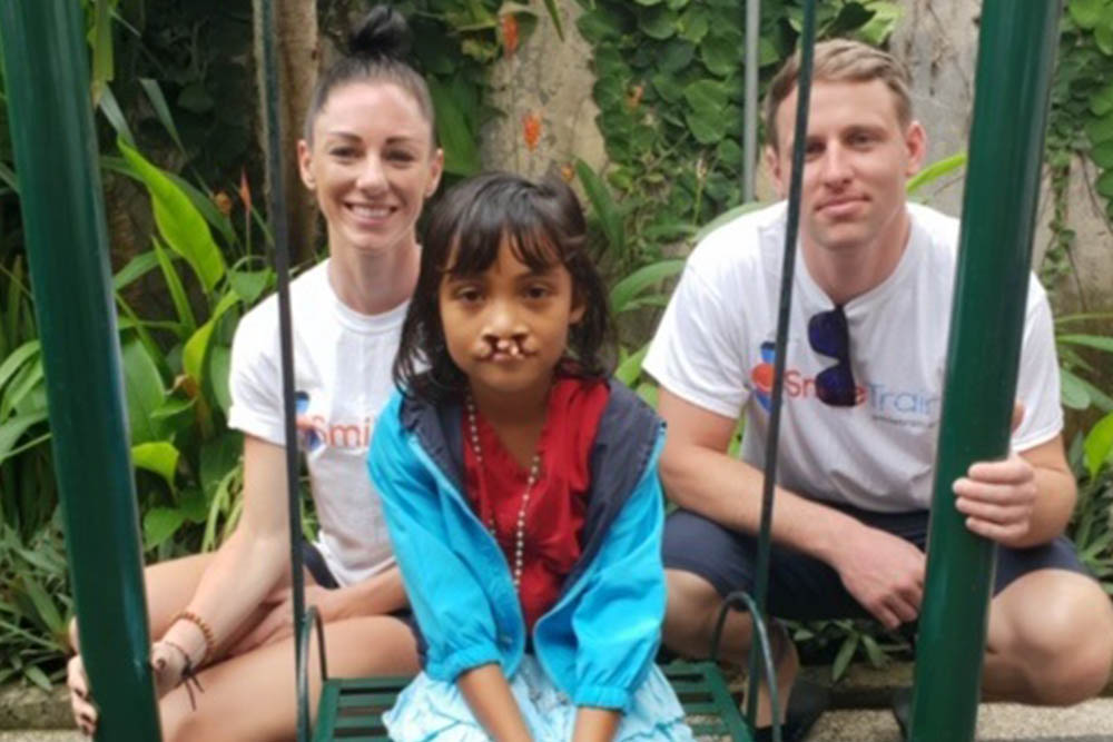 Christine with a Smile Train patient before cleft surgery