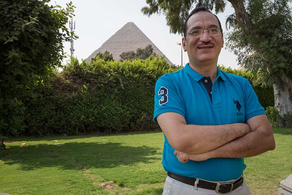 cleft surgeon stands in front of pyramid in Egypt