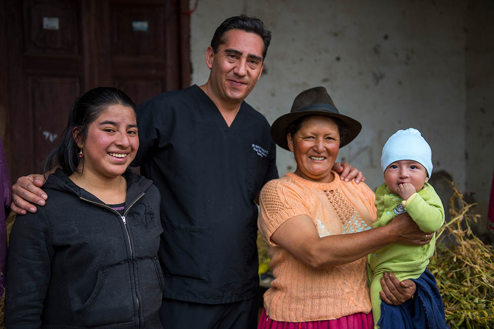 Cristian with Smile Train patient and his family