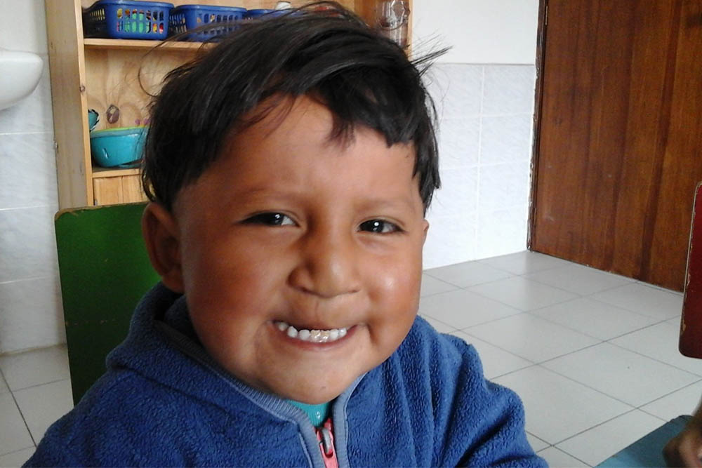 David smiling in a cleft speech therapy session