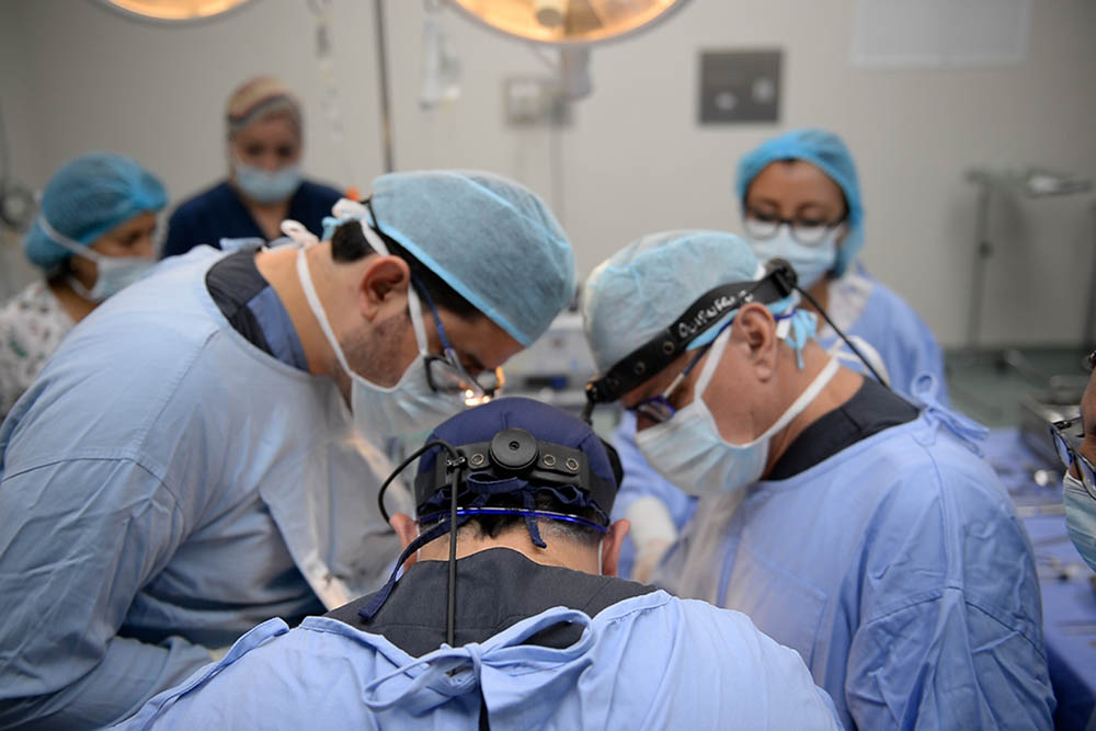 Dr Sandoval and his son doing a cleft surgery together