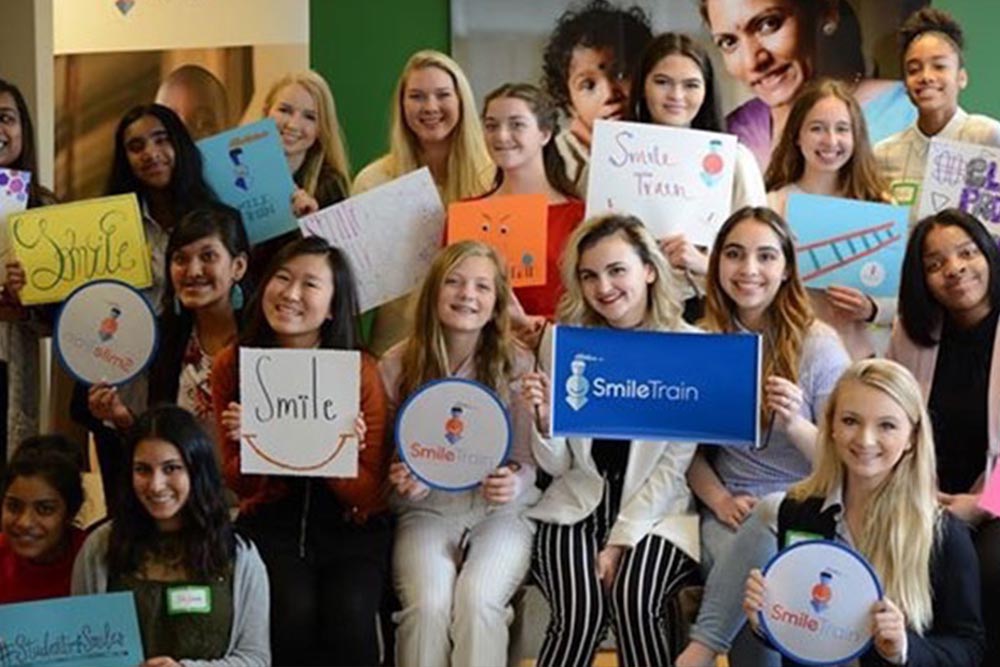 Eva poses with other Smile Train student ambassadors