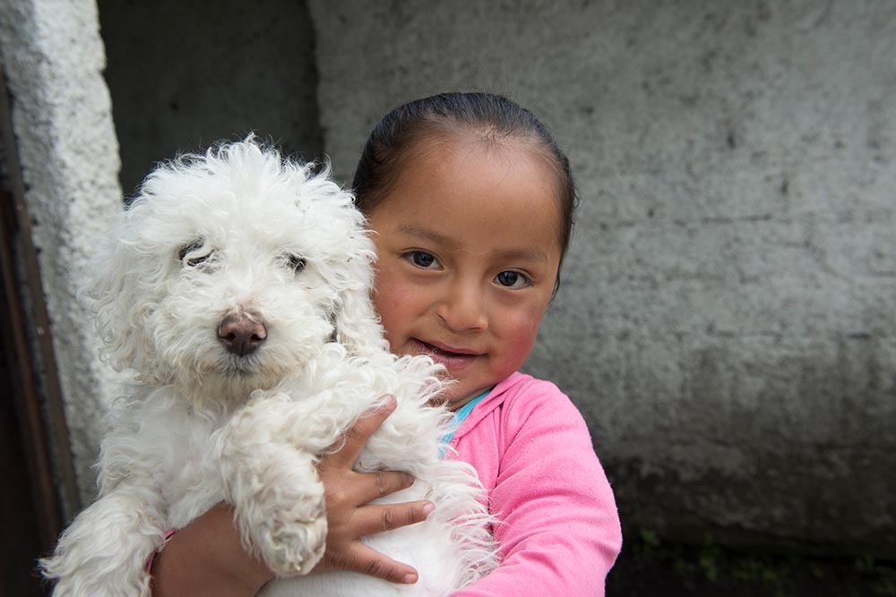 Fernanda holds up her dog