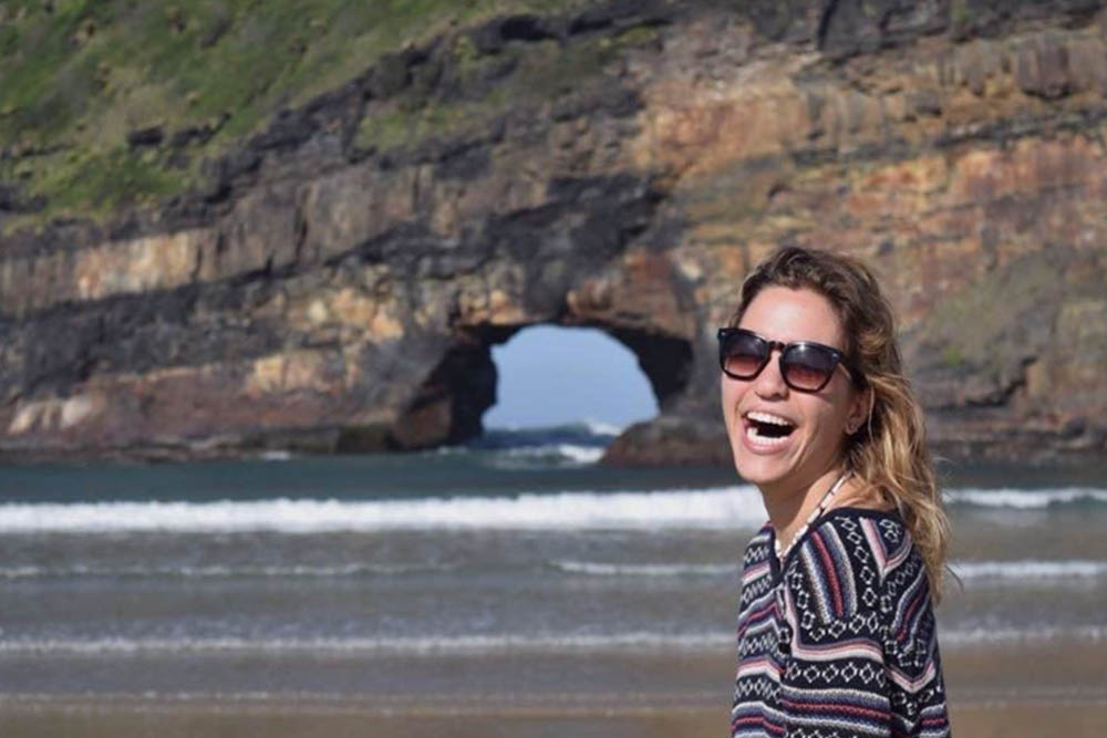 Grace Peters smiles next to a cliff backdrop