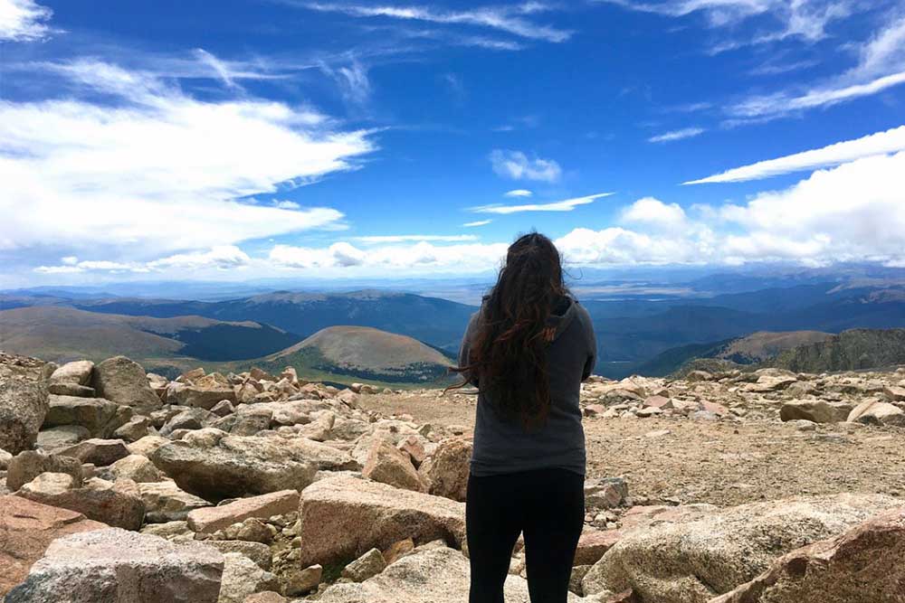 Hema looks at mountain landscape