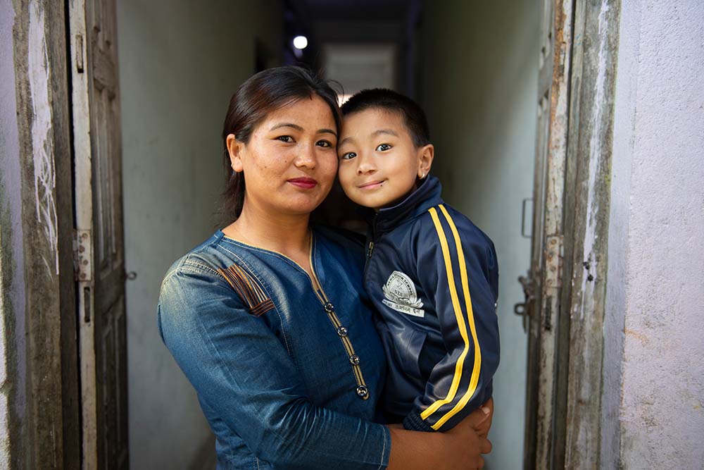 Jenious held by his mother