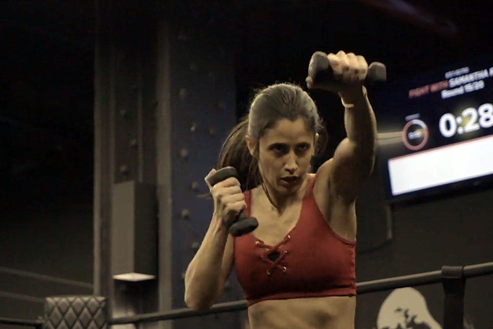 Jennifer Jacobs punching with weights