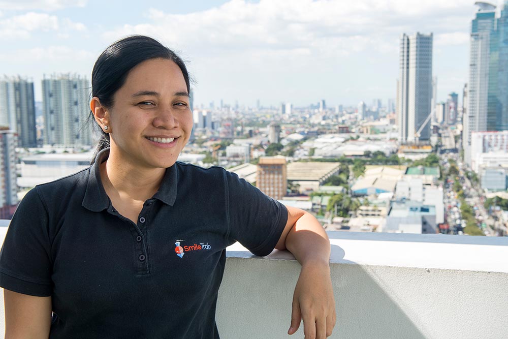 Kimmy with Manila skyline in the background