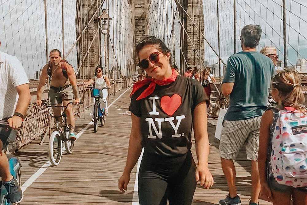Kristine walks across Brooklyn Bridge