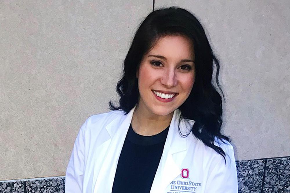 Kristine in Ohio State white coat