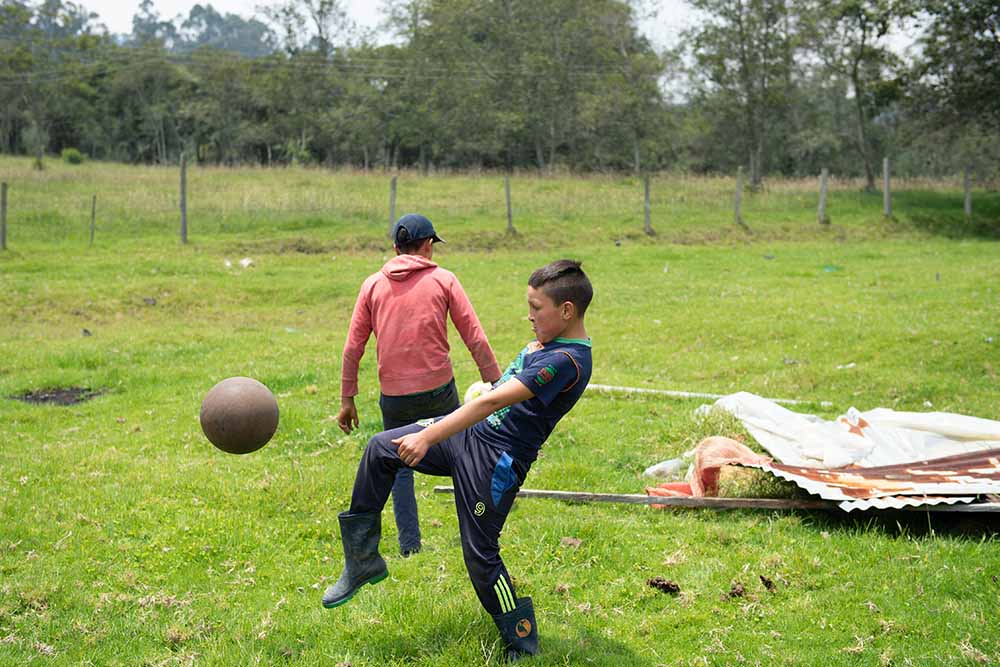 Neitan playing soccer with his brother