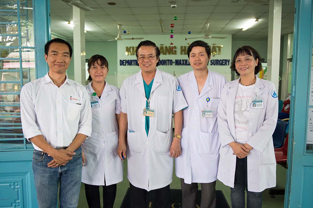 Nguyen Van Dau with his team and Smile Train staff