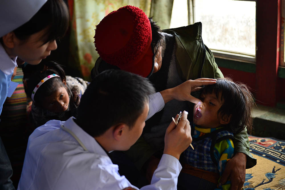 Renpuci gets her cleft checked by a doctor