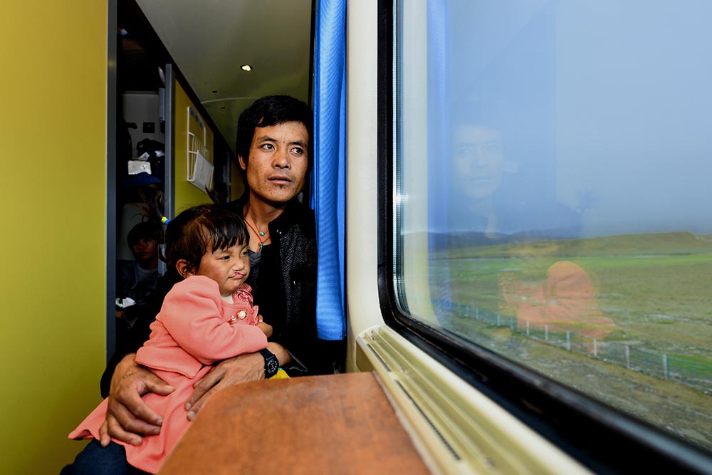 Renpuci on a train with her dad