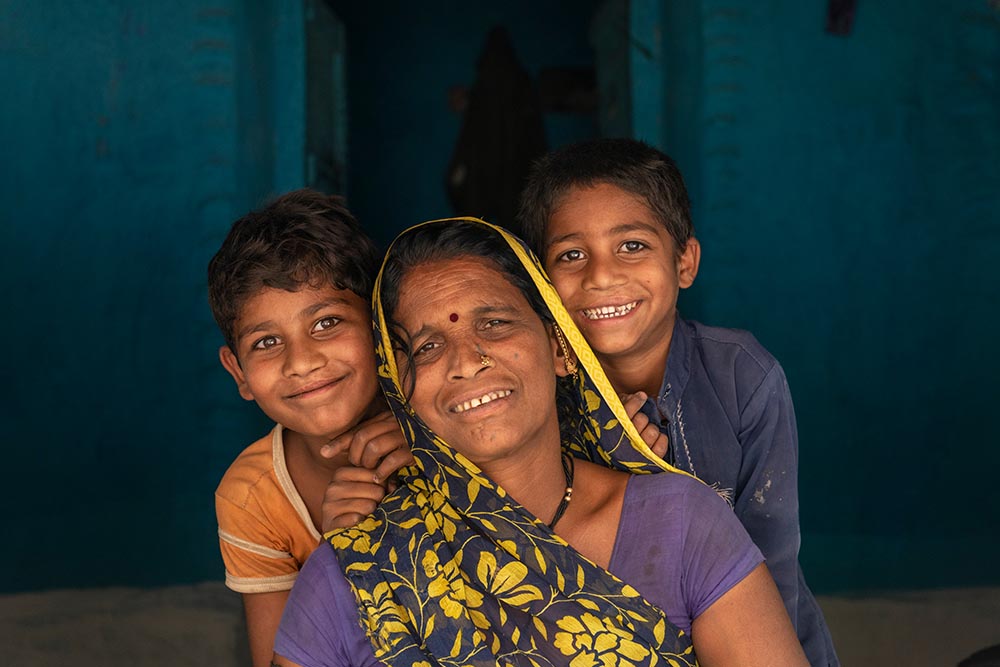 Sahil next to his mom and brother