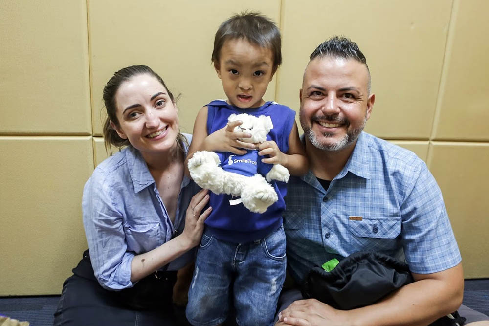 Sam Young meets a Smile Train patient