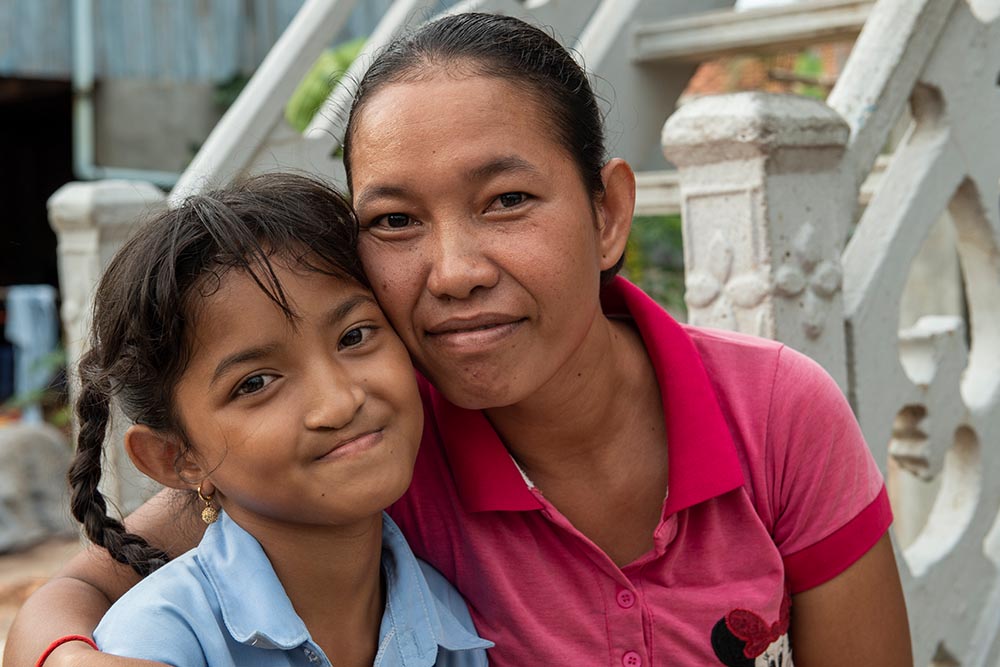 Samnang cheek to cheek with her mother