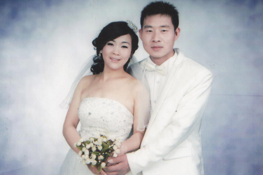 Wang Li in her beautiful wedding dress with her husband