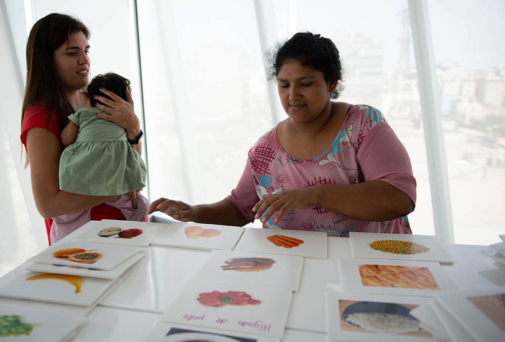 Adriana works with mother on food flash cards