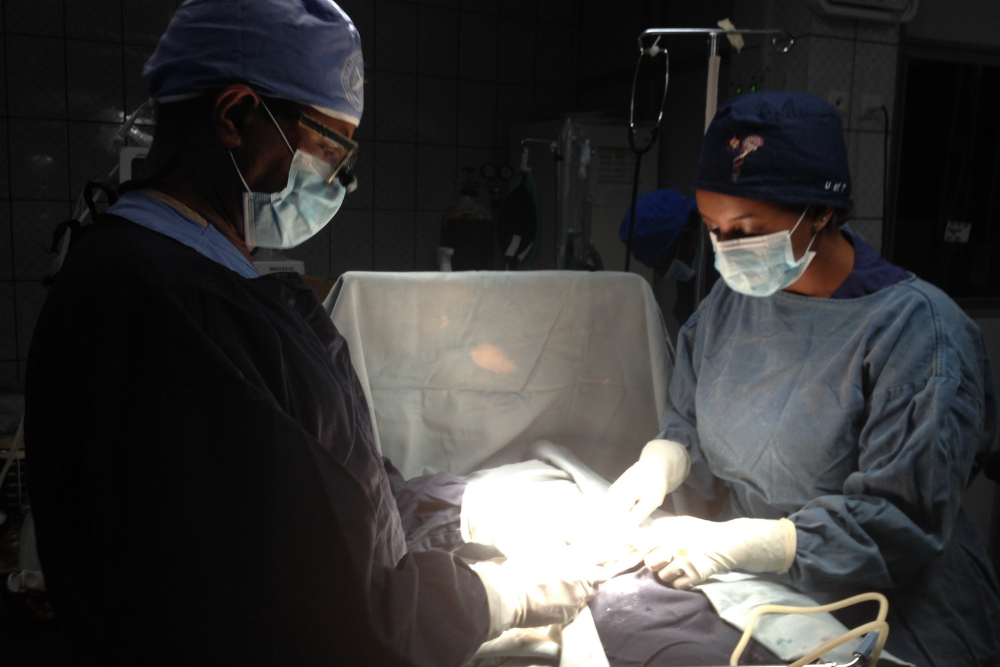 Cleft surgeons under O.R. lights