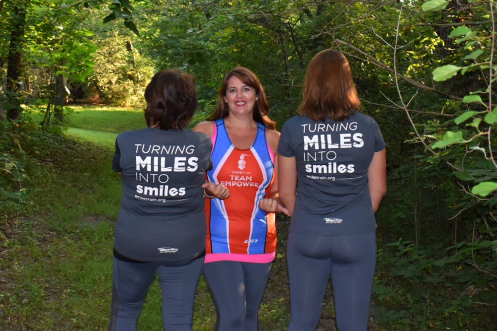 Kathryn Rodriguez and family in Smile Train Team EMPOWER gear