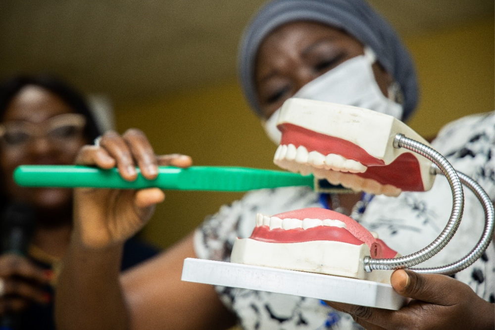 Cleft care professional demonstrating brushing technique