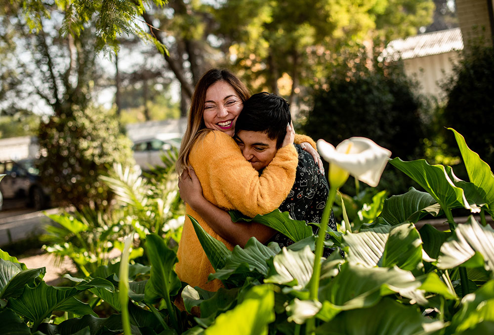 Vicente hugs mom