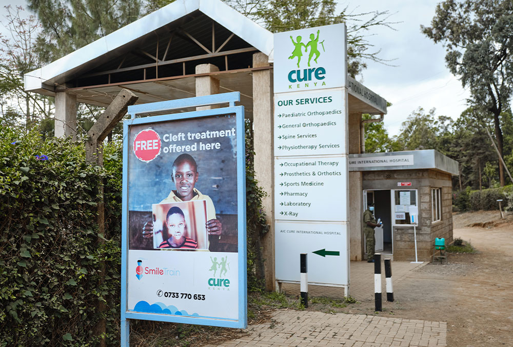 Facade of CURE Hospital Kenya with Smile Train billboard