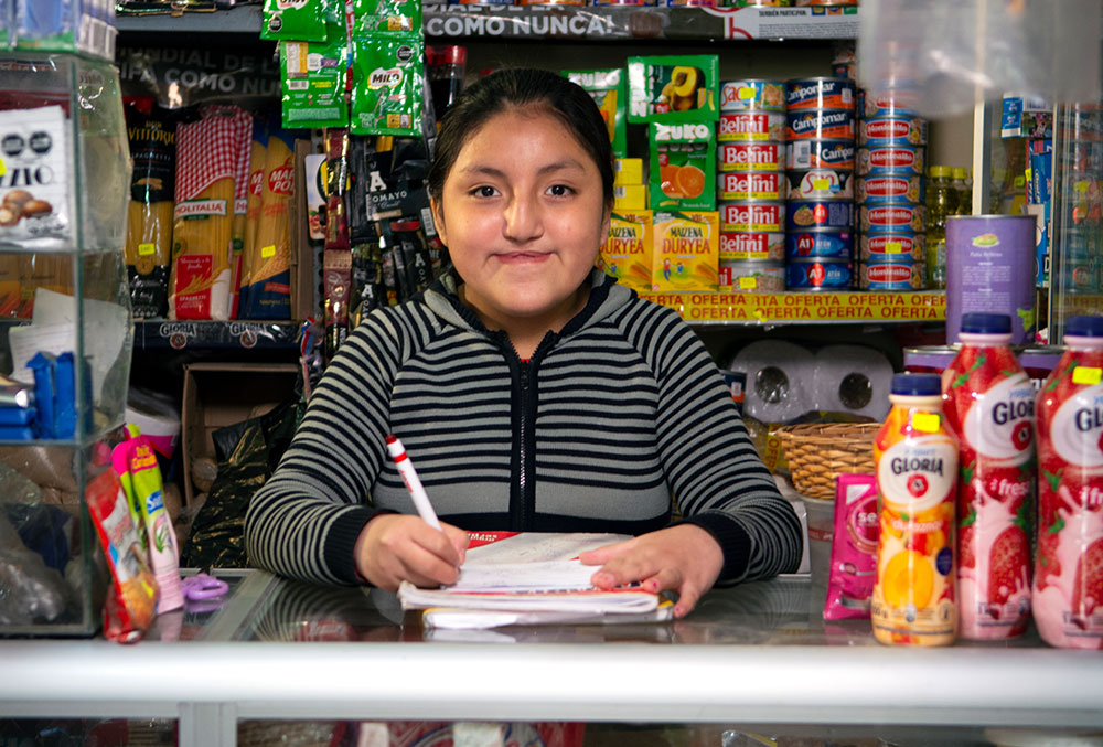 Chiara tending her family's store