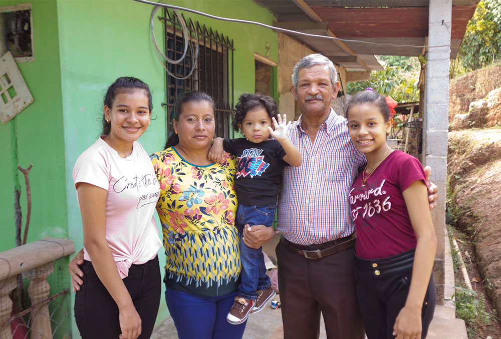 Marco with his parents and older sisters