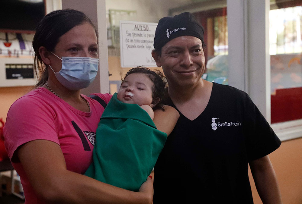 Gianna with her mother and Dr. Aldana after her cleft surgery