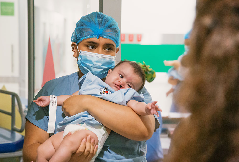 Alejandra holding Celeste just before her cleft surgery