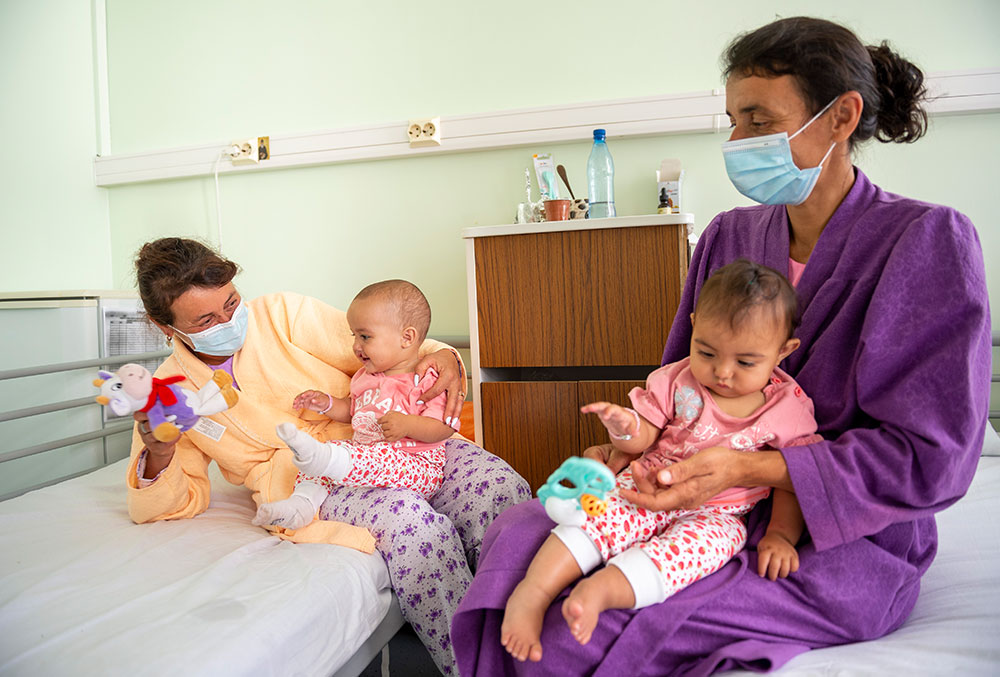 Florentina with the girls before their cleft surgeries