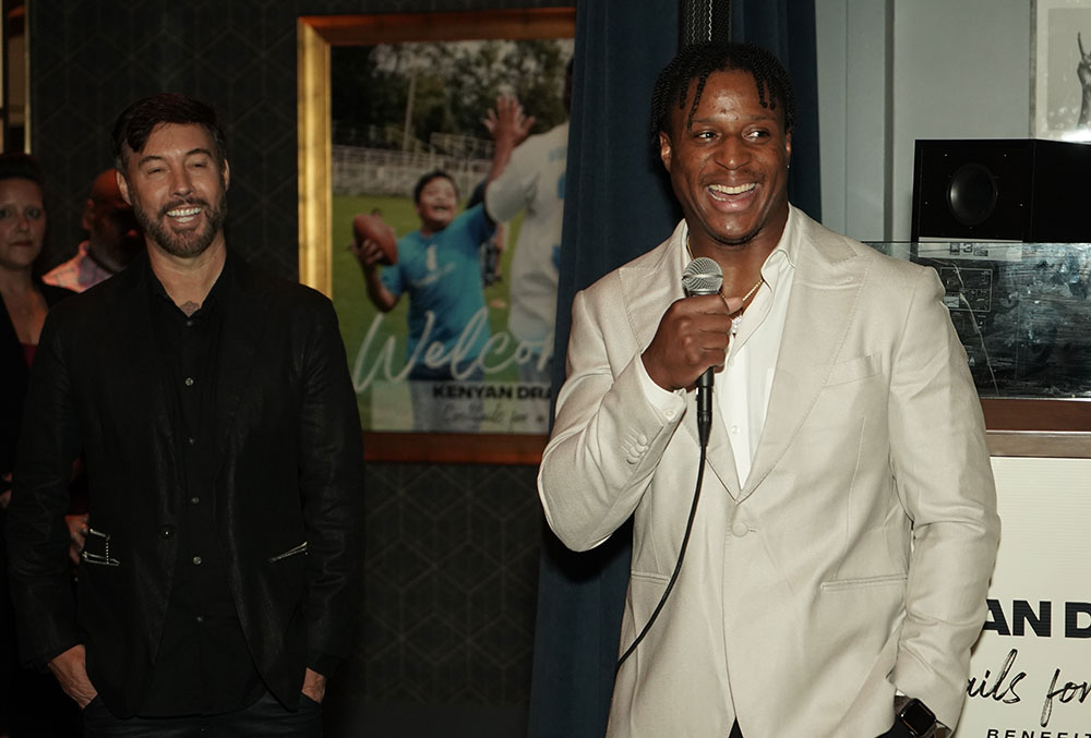 Kenyan Drake laughing while giving a speech at Cocktails for a Cause