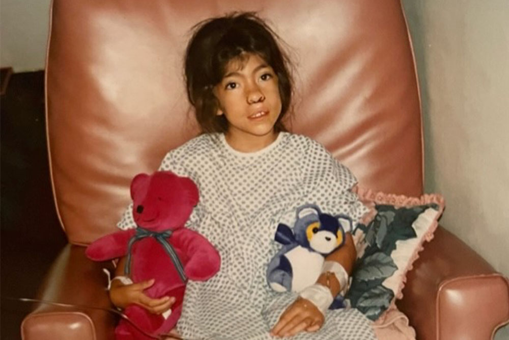 Tara recovering from surgery with teddy bears
