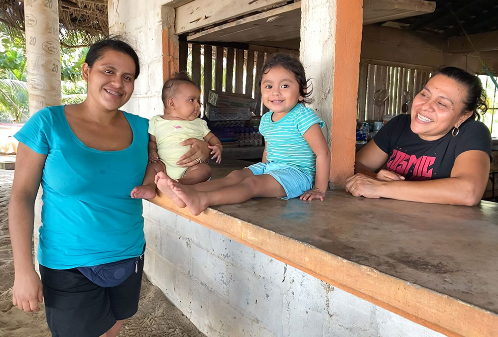 Dani with her mother, younger sister, and another relative