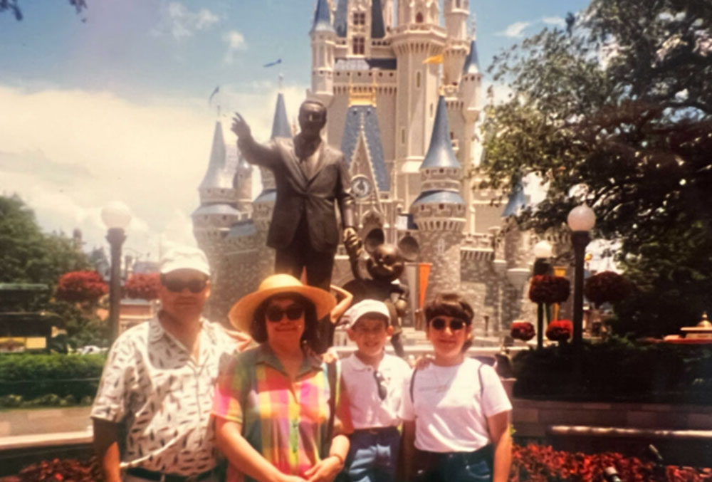 Nathalie at Disney World with her parents