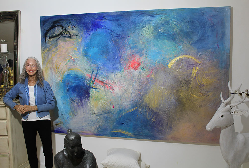 Sarah Bachrodt with one of her abstract paintings