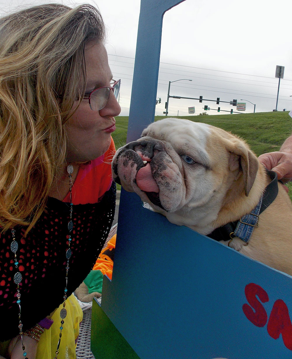 Stanley performing his duties in his kissing booth