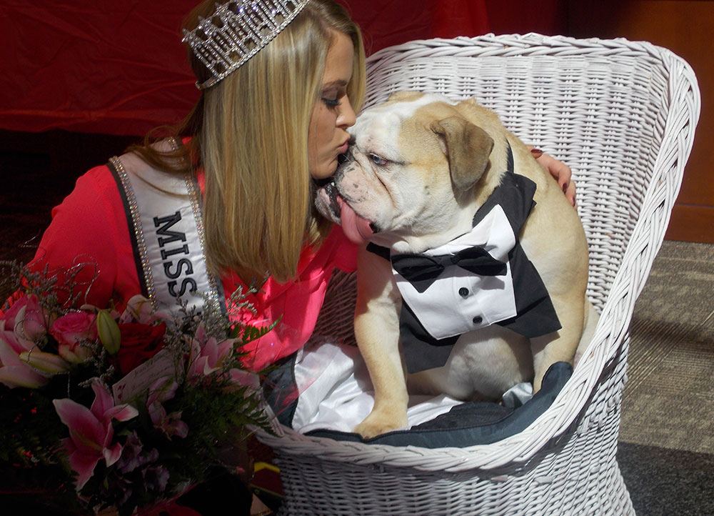 Miss USA Missouri 2016 Sydnee Stottlemyre gives a tuxedoed Stanley a smooch