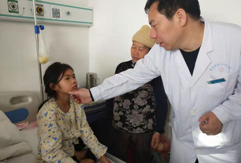 A Smile Train partner in China with a cleft patient