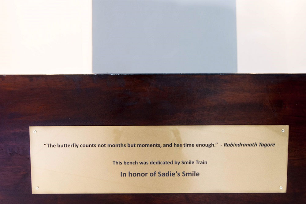 A plaque reading “The butterfly counts not months but moments, and has time enough” on a bench in the prayer room at Gertrude’s Children’s Hospital, a Smile Train partner in Nairobi, Kenya
