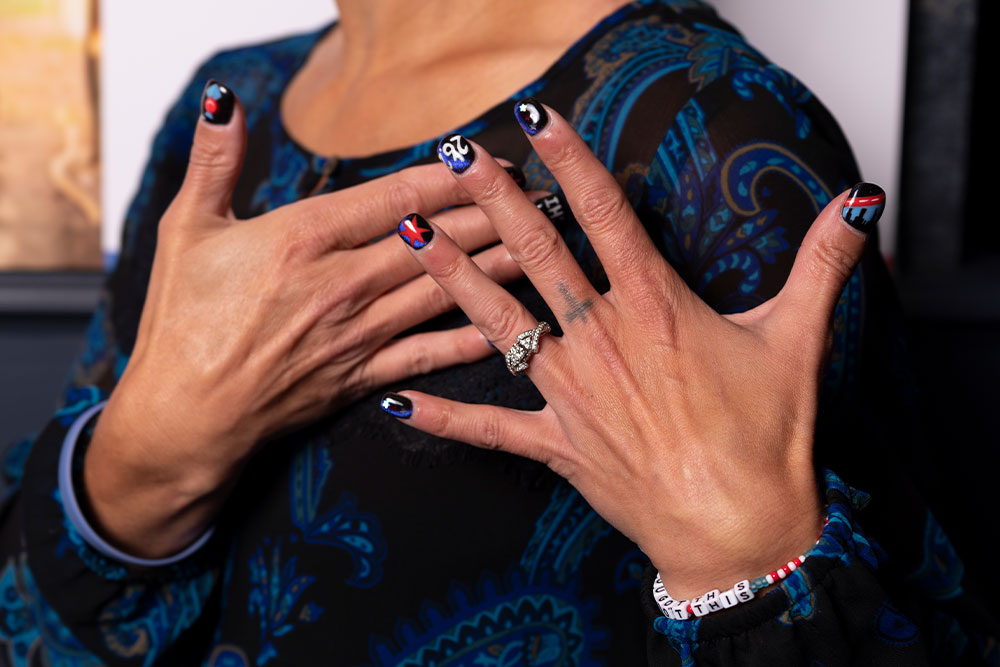 Heather McCabe’s nails painted with Smile Train and Chicago Marathon logos
