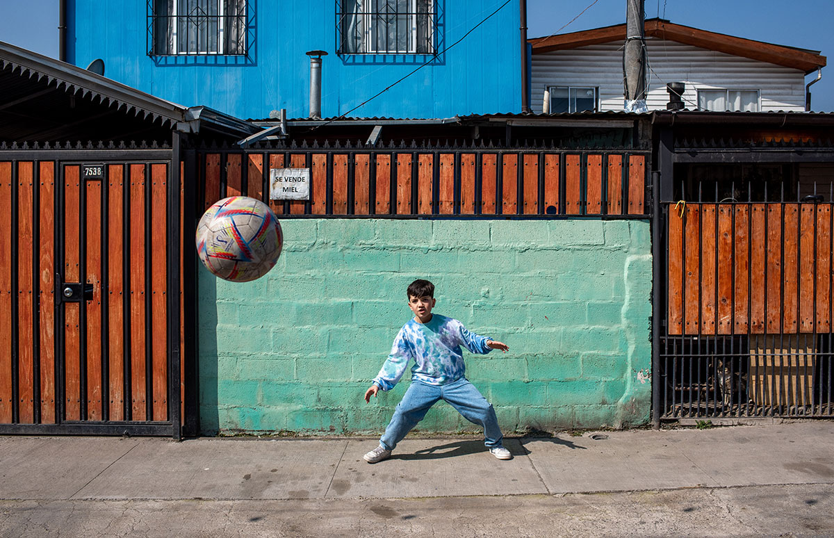 Joaquin defending the goal in a neighborhood soccer game