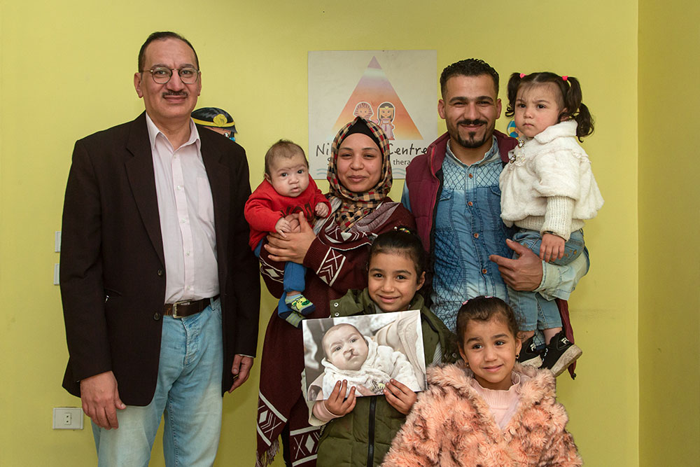 Mustafa with his parents and sisters and Dr. Aboul Hassan